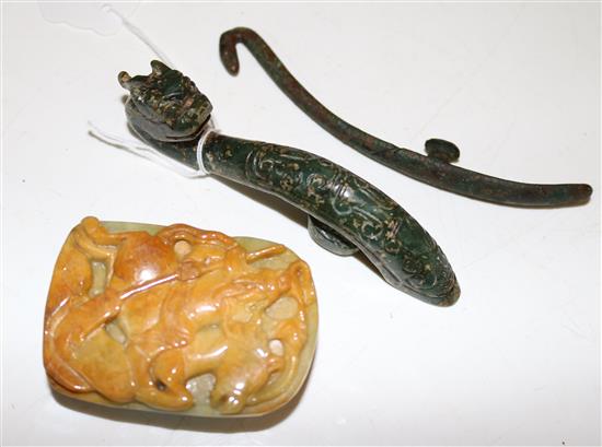 A Chinese jadeite belt buckle, a green hardstone belt hook and a bronze belt hook, 12cm(-)